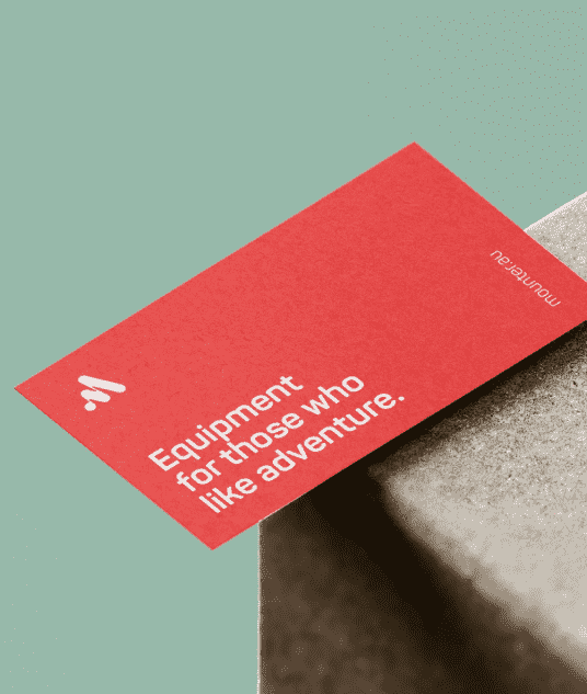 Printed red matte business cards on a textured cardboard box